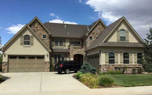 Remodeld Home Exterior Featuring Stucco and Stone Siding, New Windows and Doors and New Roof by Mountain View Corporation in Colorado
