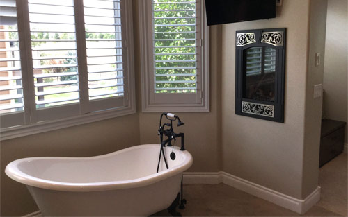 Luxury home bathroom remodel with double sink custom cabinet vanity, tile and clawfot bathtub by Mountain View Corporation in Denver Colorado