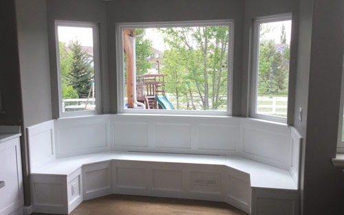 Goregous modern kitchen in white with quartz marble countertops, subway tile back splash and custom cabinets by Mountain View Corporation in Golden Colorado