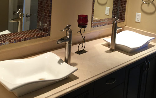 Bathroom remodel with double vanity vessel sinks and custom tile work by Mountain View Corporation in Evergreen Colorado