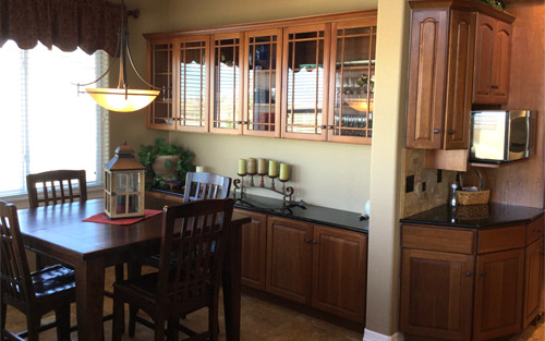 Beautiful custom wood cabinets with granite countertop, new paint, tile and windows by Mountain View Corporation in Boulder Colorado