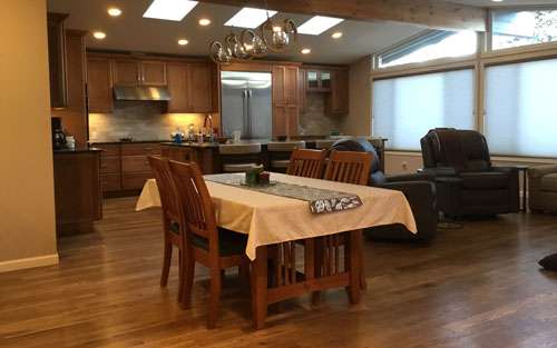Modern open kitchen remodel, custom installed wood cabinets, granite countertops, wood floors by Mounain View Corporation in Centennial Colorado