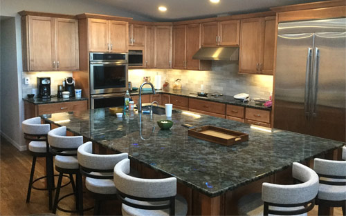 Kitchen remodel with granite counter tops, custom built wood cabinets, hardwood floors by Mountain View Corporation in Lakewood Colorado