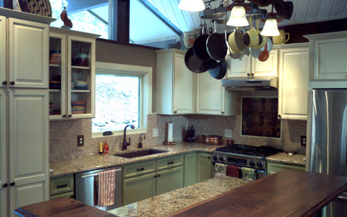 Remodeled country kitchen with granite countertops and white wood custom built cabinetry by Mountain View Corporation in Loveland Colorado