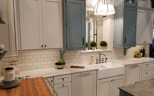 Stone arch doorway with iron gate for custom built wine cellar by Mountain View Corporation in Glendale Colorado